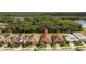Aerial shot displays attractive homes with tile roofs and manicured landscaping, with a location marker at 11499 Renaissance Blvd, Venice, FL 34293