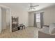 Versatile room with neutral decor, wood-look floors, and comfortable seating at 11499 Renaissance Blvd, Venice, FL 34293