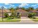Charming single-story home with a two car garage, brick paver driveway and well manicured lawn at 11499 Renaissance Blvd, Venice, FL 34293