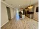 Open-concept living area features tile floors that connects the kitchen, dining, and living spaces at 11499 Renaissance Blvd, Venice, FL 34293