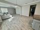 Bright and open living area with tile flooring, a comfortable sectional sofa, and lots of natural light at 11499 Renaissance Blvd, Venice, FL 34293