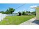 Expansive backyard with a storage shed, grassy lawn, and a secure fence at 1204 25Th W Ave, Palmetto, FL 34221