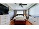 Comfortable bedroom with dark accent walls, ceiling fan, and storage at 1204 25Th W Ave, Palmetto, FL 34221