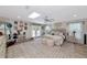 Bright bedroom with a skylight, french doors to the outside, and a luxurious textured rug at 1208 Oak Hammock Rd, Sarasota, FL 34240