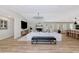 Spacious living room featuring a fireplace, a modern chandelier, and luxury vinyl plank flooring at 1208 Oak Hammock Rd, Sarasota, FL 34240