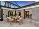 Covered outdoor dining area with a large table and seating, perfect for entertaining at 1208 Oak Hammock Rd, Sarasota, FL 34240
