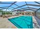 Stunning backyard with a large pool, screened enclosure, and outdoor living spaces perfect for entertaining at 1208 Oak Hammock Rd, Sarasota, FL 34240