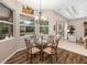 Inviting breakfast nook with a glass table, comfortable seating, and view of the outdoors at 12810 Kite Dr, Bradenton, FL 34212
