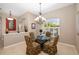 Cozy dining room featuring a decorative chandelier and natural light at 12810 Kite Dr, Bradenton, FL 34212