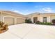 Charming home with a three car garage, well-manicured landscaping, and a welcoming entrance at 12810 Kite Dr, Bradenton, FL 34212