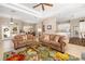 Spacious living room featuring comfortable seating, and an open layout to the kitchen at 12810 Kite Dr, Bradenton, FL 34212
