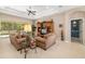 Inviting living room with comfortable sofas, entertainment center, and backyard access at 12810 Kite Dr, Bradenton, FL 34212
