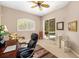 Office with a dark wood desk and a ceiling fan at 12810 Kite Dr, Bradenton, FL 34212