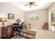 Office with a dark wood desk, ceiling fan, and chair at 12810 Kite Dr, Bradenton, FL 34212