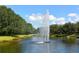 Scenic view of the community pond with a central fountain and green surroundings at 12810 Kite Dr, Bradenton, FL 34212