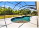 Backyard screened-in pool and hot tub. A great way to stay cool and relax! at 12810 Kite Dr, Bradenton, FL 34212