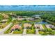 Wide neighborhood view of homes surrounded by mature trees and a variety of waterways and ponds at 12822 Kite Dr, Bradenton, FL 34212