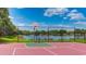 Well-maintained basketball court overlooking a serene pond, perfect for active recreation and enjoying the outdoors at 12822 Kite Dr, Bradenton, FL 34212
