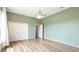 Bedroom with wood floors, a closet, recessed lighting, and mint-green walls at 12822 Kite Dr, Bradenton, FL 34212
