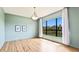 Light-filled room with wood floors, a view of the home's exterior, and recessed lighting at 12822 Kite Dr, Bradenton, FL 34212