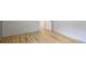 Inviting room featuring hardwood floors, ample natural light, and a doorway to another room at 12822 Kite Dr, Bradenton, FL 34212