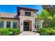 Attractive clubhouse exterior with brick paver sidewalk, stone pillars, and well maintained landscaping at 12822 Kite Dr, Bradenton, FL 34212