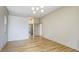 Hallway featuring hardwood floors and an open doorway at 12822 Kite Dr, Bradenton, FL 34212