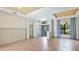 Bright living room with tile floors, tray ceilings, and a view of the front entryway at 12822 Kite Dr, Bradenton, FL 34212