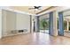 Bright living room with access to pool and wood-look tile flooring at 12822 Kite Dr, Bradenton, FL 34212