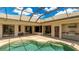 Expansive screened-in patio featuring a pool, outdoor kitchen, and plenty of space for entertaining at 12822 Kite Dr, Bradenton, FL 34212