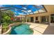 Inviting screened-in pool with lush landscaping and covered patio, ideal for outdoor living and entertaining at 12822 Kite Dr, Bradenton, FL 34212