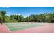 A community featuring well-maintained outdoor tennis courts surrounded by lush landscaping at 12822 Kite Dr, Bradenton, FL 34212