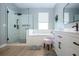 Bathroom featuring a walk-in shower, tub, vanity, modern fixtures at 12841 Balsam Ter, Bradenton, FL 34212