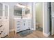 A bright bathroom with a modern vanity and linen cabinet at 12841 Balsam Ter, Bradenton, FL 34212