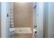 Bright bathroom showcasing a tiled walk-in shower, toilet, and neutral color scheme at 12841 Balsam Ter, Bradenton, FL 34212