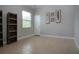 Bright, airy room with tile floors and minimalist decor at 12841 Balsam Ter, Bradenton, FL 34212