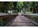 A wooden bridge in this community leads to a playground and amenities at 12841 Balsam Ter, Bradenton, FL 34212