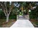 A wooden bridge surrounded by trees and greenery offers a scenic pathway in this community at 12841 Balsam Ter, Bradenton, FL 34212