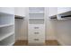 Well-organized walk-in closet with custom shelves and plenty of space at 12841 Balsam Ter, Bradenton, FL 34212
