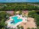 Aerial shot featuring the pool, tennis courts, and playgrounds, showcasing a complete recreational complex for residents at 12841 Balsam Ter, Bradenton, FL 34212