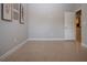 Neutral space with tile flooring, white trim, and doorway with an open view of another room at 12841 Balsam Ter, Bradenton, FL 34212