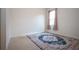Bright room with tile flooring, neutral walls, and a vibrant rug adding a pop of color at 12841 Balsam Ter, Bradenton, FL 34212