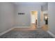 Bright space with tile flooring, neutral walls, and an open layout providing seamless transitions to adjacent rooms at 12841 Balsam Ter, Bradenton, FL 34212