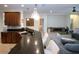 A spacious kitchen with granite countertops, stainless steel sink, and seating at the breakfast bar at 12841 Balsam Ter, Bradenton, FL 34212