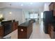 Kitchen with granite countertops and an island and a view of a breakfast nook at 12841 Balsam Ter, Bradenton, FL 34212