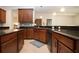 Spacious kitchen with granite countertops, kitchen island, and stainless steel appliances at 12841 Balsam Ter, Bradenton, FL 34212