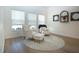 Cozy seating area featuring plush armchairs, soft lighting and a decorative rug at 12841 Balsam Ter, Bradenton, FL 34212