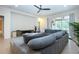 Inviting living room with a large sectional sofa and view to the outdoor pool area at 12841 Balsam Ter, Bradenton, FL 34212