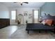 Bedroom with stylish decor, wood floors, walk-in closet, and art at 12841 Balsam Ter, Bradenton, FL 34212