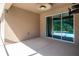 A covered patio with sliding glass doors leading to a pool area, perfect for outdoor relaxation at 12841 Balsam Ter, Bradenton, FL 34212